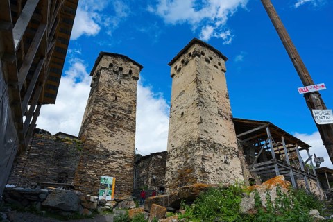 Two old stone towers under a cloudy sky, defensive towers, Ushguli, Ushguli, Shibiani district,