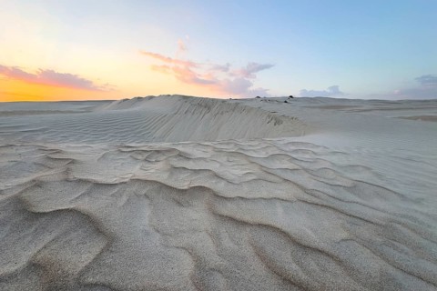Sunset, white sand dunes in the Khaluf desert, Oman
