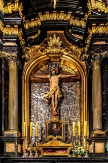Altar with Christ sculpture, silverwork background, depicting Jerusalem, St. Mary's Church, 14th