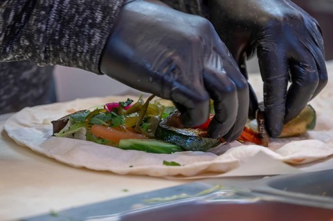 Preparation of falafel with vegetables at a falafel stand in the pedestrian zone, Nuremberg, Middle