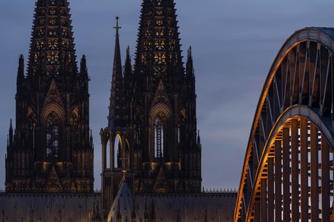Evening atmosphere, Cologne Cathedral illuminated with LED lamps and the Hohenzollern Bridge,