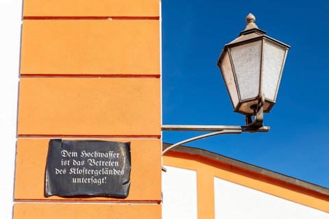 Lantern and façade with sign, Floods are prohibited from entering the monastery grounds, St.
