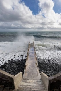 Pier during storm, bridge with waves, Atlantic Ocean, Madeira, Portugal