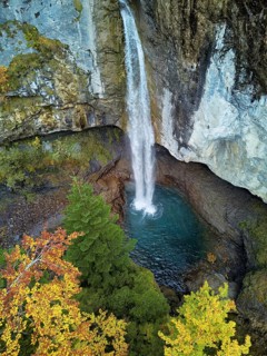 Aerial view of Berglistüber waterfall in autumn-colored surroundings, Linthal, Klausenpass, Canton