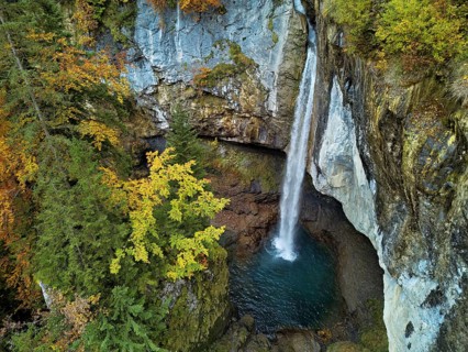 Aerial view of Berglistüber waterfall in autumn-colored surroundings, Linthal, Klausenpass, Canton