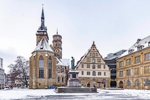 Winter in Stuttgart. The city is wintry white early in the morning. Schillerplatz with collegiate