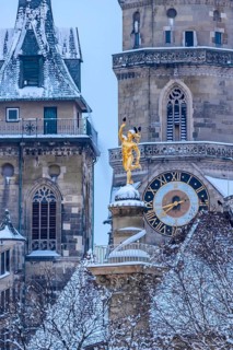 Winter in Stuttgart. The city is wintry white early in the morning. Collegiate church with