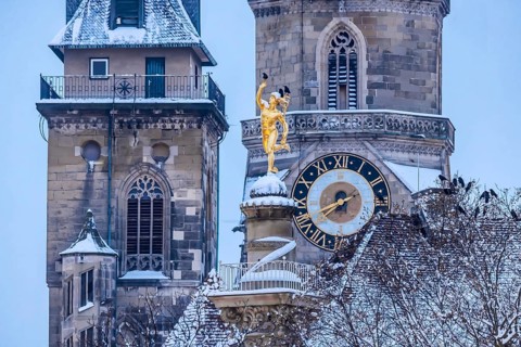 Winter in Stuttgart. The city is wintry white early in the morning. Collegiate church with
