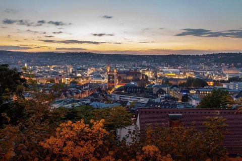12 Sep 2018 at dusk, glowing city lights illuminate downtown with panoramic view. Stuttgart,