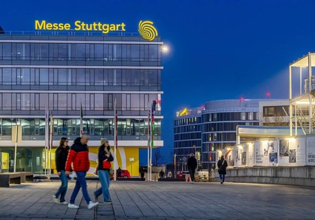 Messe Stuttgart in the evening. Administration building with illuminated logo. Stuttgart,