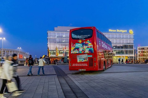 Stuttgart City Tour. Red double-decker for sightseeing tours at Messe Stuttgart. Stuttgart,