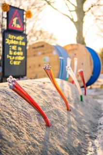 Various thin cables stick out of the ground of a construction site, fiberglass groundbreaking,