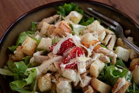 Classic Caesar salad, close-up, natural light, selective focus, horizontal