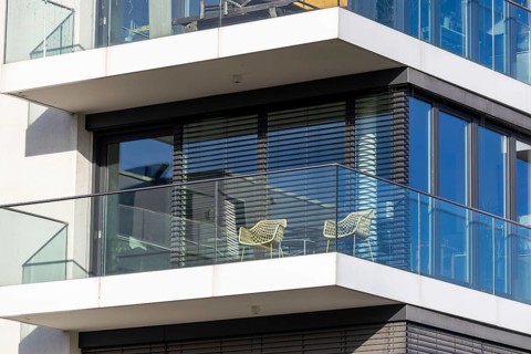 Modern blinds or modern external blinds on the window of a new residential building