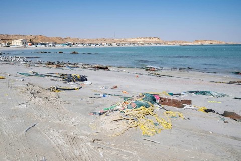 Garbage, fishing nets and plastic on the beach, Oman