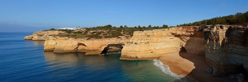 Rocky coast with caves, Praia da Corredoura, Algarve, Portugal