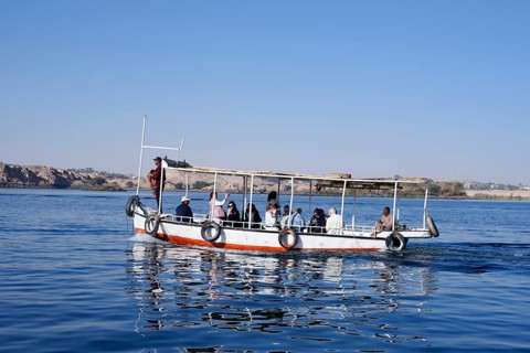 Sightseeing boat with tourists on Lake Nasser, Aswan, Egypt