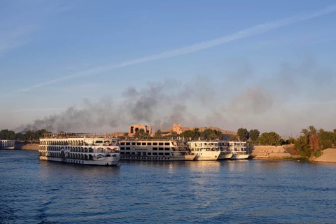 Nile cruise ships at the pier at the double temple of Kom Ombo, Kom Ombo, Egypt