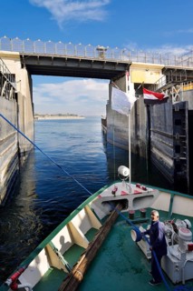 Nile cruise ship leaves the lock at the Esna dam, Esna, Egypt