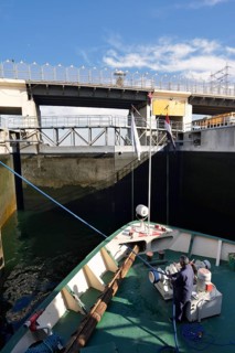 Nile cruise ship enters the lock at the Esna dam, Esna, Egypt