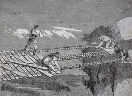 A rope bridge, dew bridge, suspension bridge whose walkway follows the sagging suspension cables,