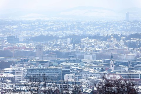 March 18, 2018, winter view with snow toward city center with station and tower from Mount
