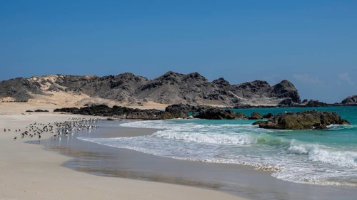 White sandy beach, secluded bay, turquoise blue sea, Omabn