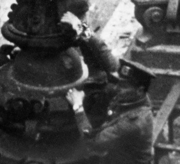Excerpt from the photo: At the Berlin Reichstag, May 2, 1945, three Soviet soldiers hoist the flag