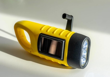 Crank operated flashlight, by turning the crank, we generate electricity in a dynamo, which charges