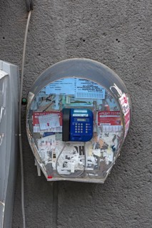 Public telephone on a house wall, Drochobych, Ukraine