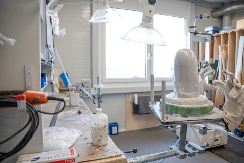 Workshop area with plaster and tools for making prostheses under lamps, medical supply store