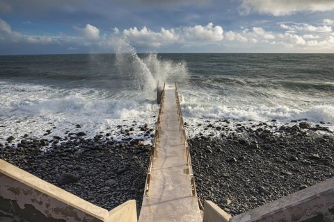 Pier during storm, bridge with waves, Atlantic Ocean, Madeira, Portugal
