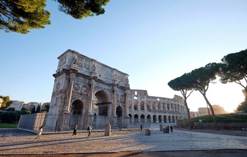 Arch of Constantine and Colosseum at sunrise, Rome, Lazio, Italy
