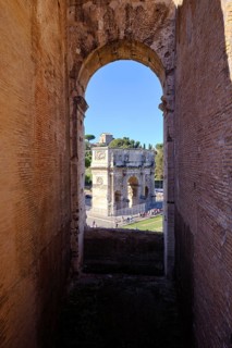 View through round arch of Constantine's Arch from the Colosseum, Rome, Lazio, Italy