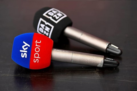 Two microphones are lying on the table, competition, competitor channel, logo, SKY, DAZN, soccer