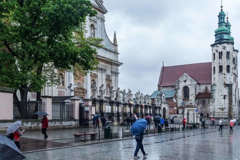 Sculptures of saints in front of St. Peter and Paul Church, St. Andrew's Church on the right,