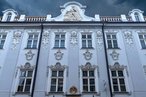 Historic house façade, a relief of Saint Florian on the gable, Krakow, Poland