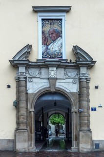 Mosaic portrait of Pope John Paul II above an entrance portal, Krakow, Poland