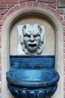 Fountain figure in the courtyard of Collegium Maius, Krakow, Poland