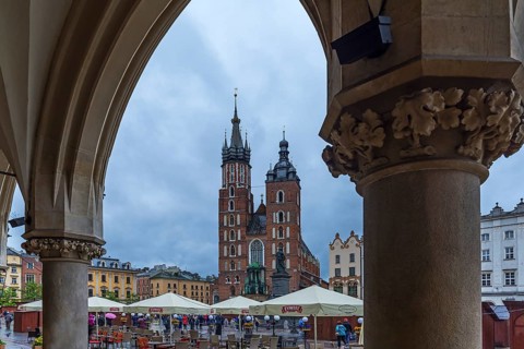 View of St. Mary's Basilica from the arcades of the Cloth Hall, Market Square, Krakow, Poland