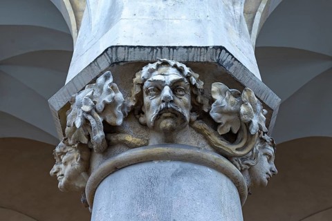 Reliefs on the pillars of the arcades of the Cloth Hall, Krakow, Poland