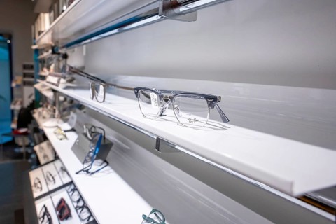 Elegant eyeglass shelf with clear glasses in a modern showroom, optician, Pforzheim