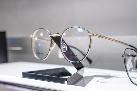 Close-up of modern round glasses on a simple stand, optician, Pforzheim