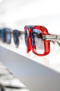 Close-up of red and blue sunglasses on a shelf, optician, Pforzheim