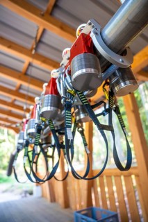Close-up of safety equipment with straps and metal parts in a wooden structure, Himmelsglück