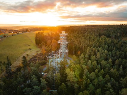 Tower immersed in the warm light of the dawning day, Himmelsglück observation tower with Flying