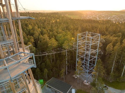 Detailed view of the tower with adjacent climbing course over the treetops, Himmelsglück