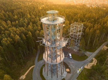 Observation tower in a thick forest with golden light late in the afternoon, Himmelsglück