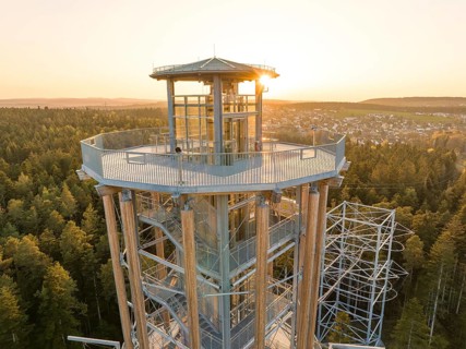 Higher view of the observation tower and surrounding forests in sunlight, Himmelsglück observation