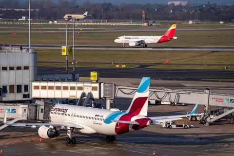 Düsseldorf airport, DUS, terminal A Eurowings plane at the gate, Iberia One World plane after